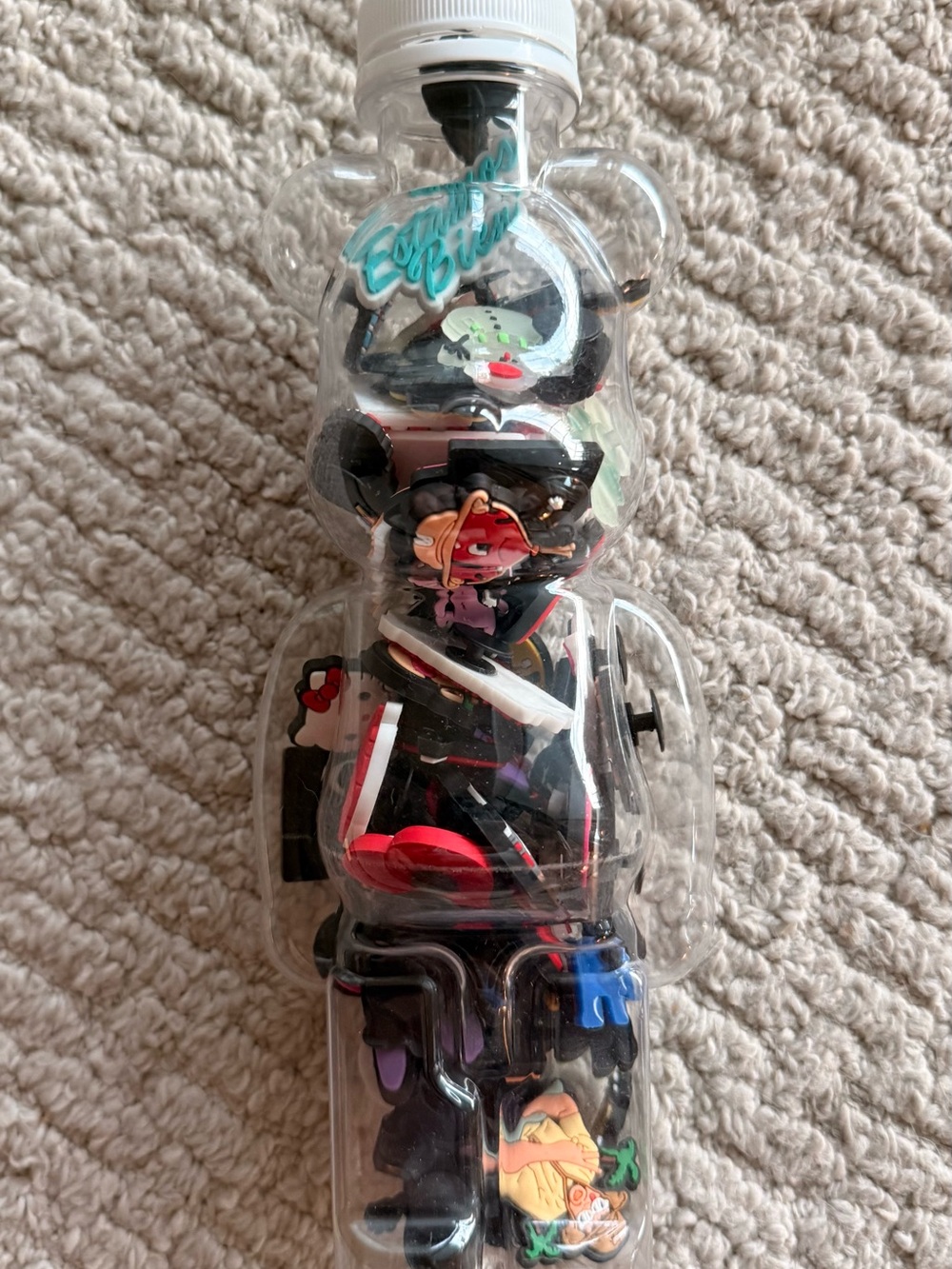 Toy Bear Bottle with Assorted croc Puerto Rican, hello kitty , and random charm